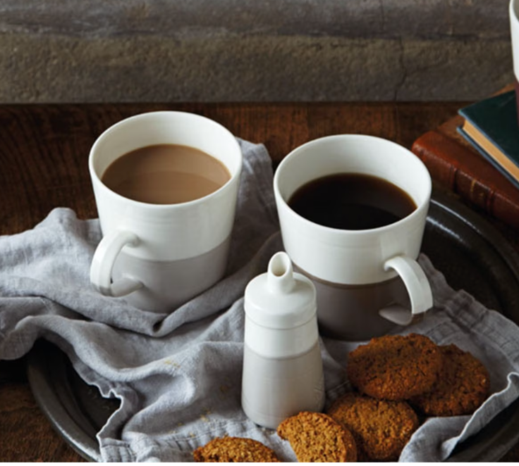coffee and tea mugs with biscuits 